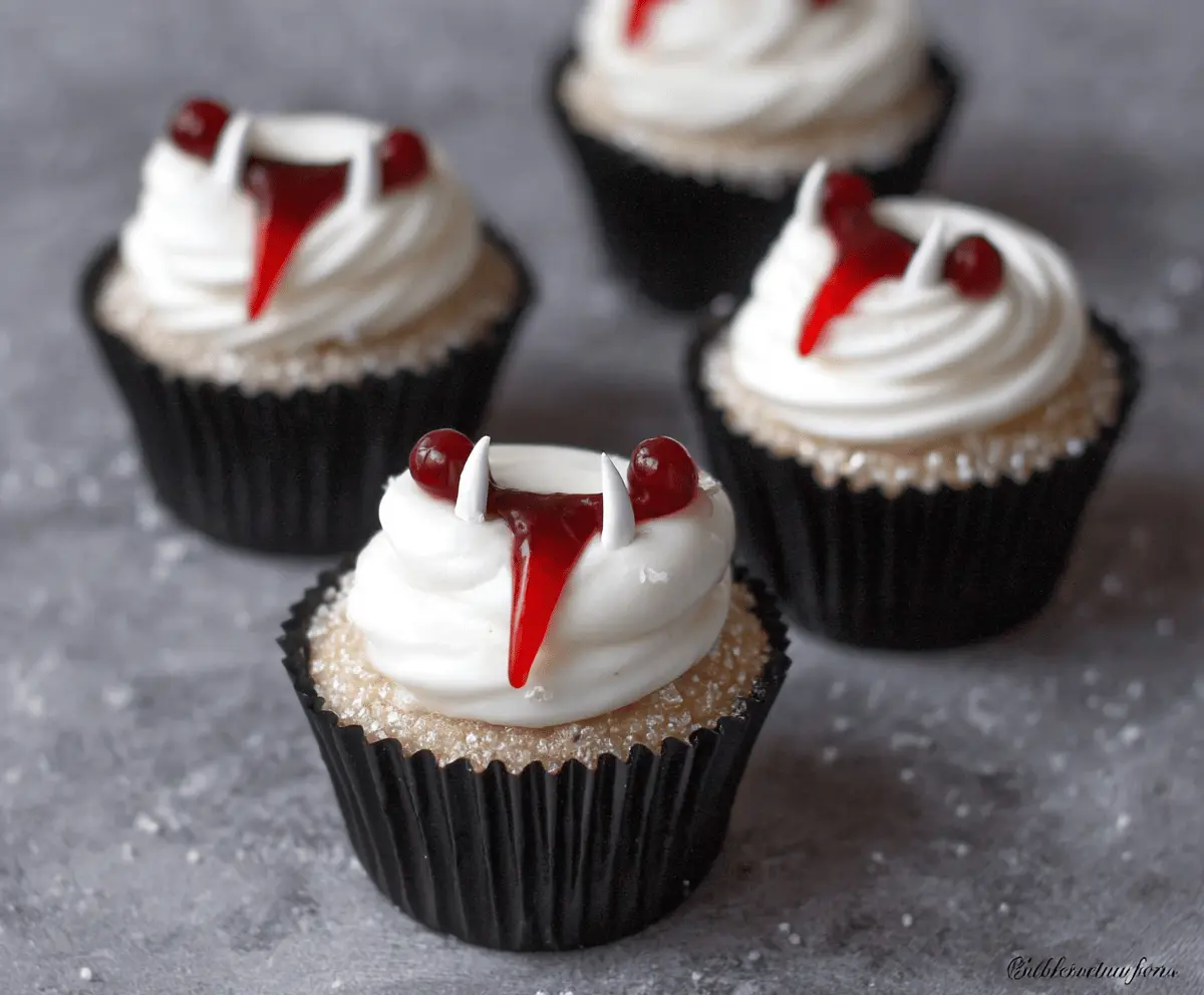 Delicious Vampire Bite Cupcakes topped with red icing and spooky edible eyes, perfect for Halloween treats.