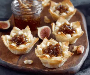 Delicious Brie and Fig Phyllo Cups served on a platter for appetizer or snack.