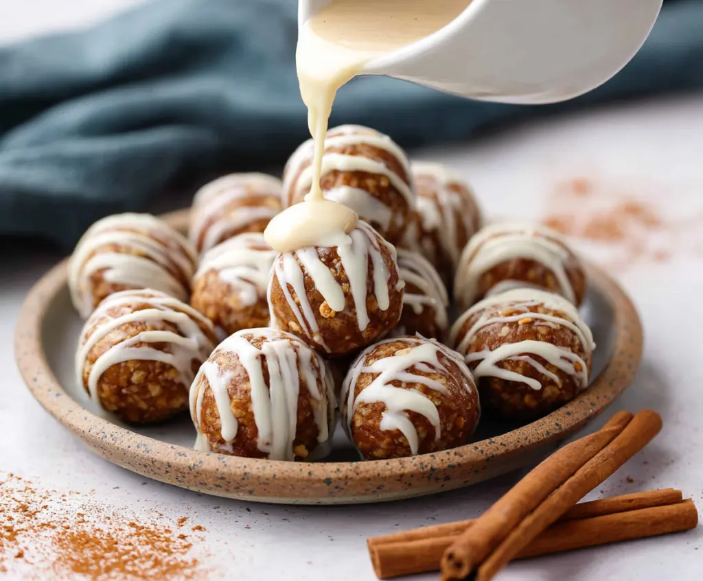 Delicious Cinnamon Roll Protein Bites with creamy icing, healthy snack for fitness lovers.