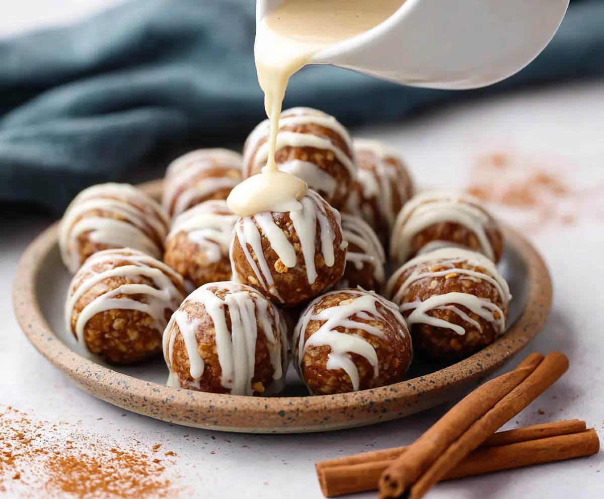 Delicious Cinnamon Roll Protein Bites with creamy icing, healthy snack for fitness lovers.