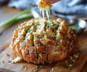 Delicious Bloomin Onion Parmesan Bread served on a plate, showing crispy golden crust and melted cheese.