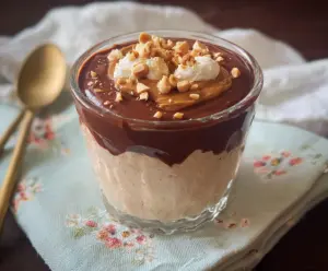 Creamy chocolate peanut butter cottage cheese bowl with chopped nuts on top
