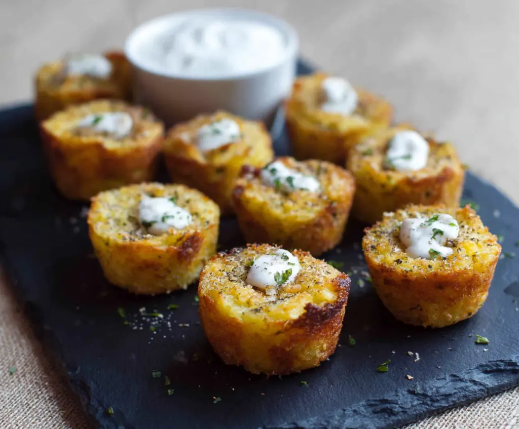 Delicious mashed potato bites garnished with herbs, perfect as a tasty appetizer