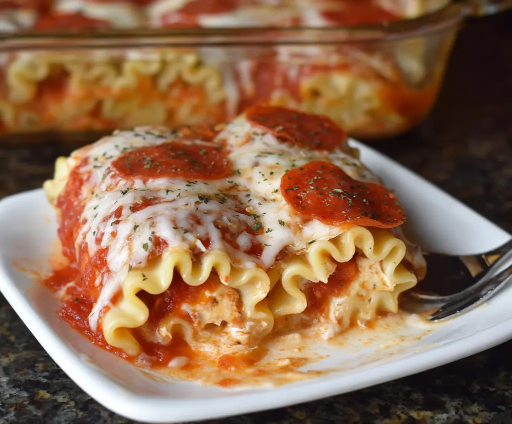 Delicious Pepperoni Pizza Lasagna Roll Ups with melted cheese and pepperoni slices, perfect for a flavorful Italian meal.
