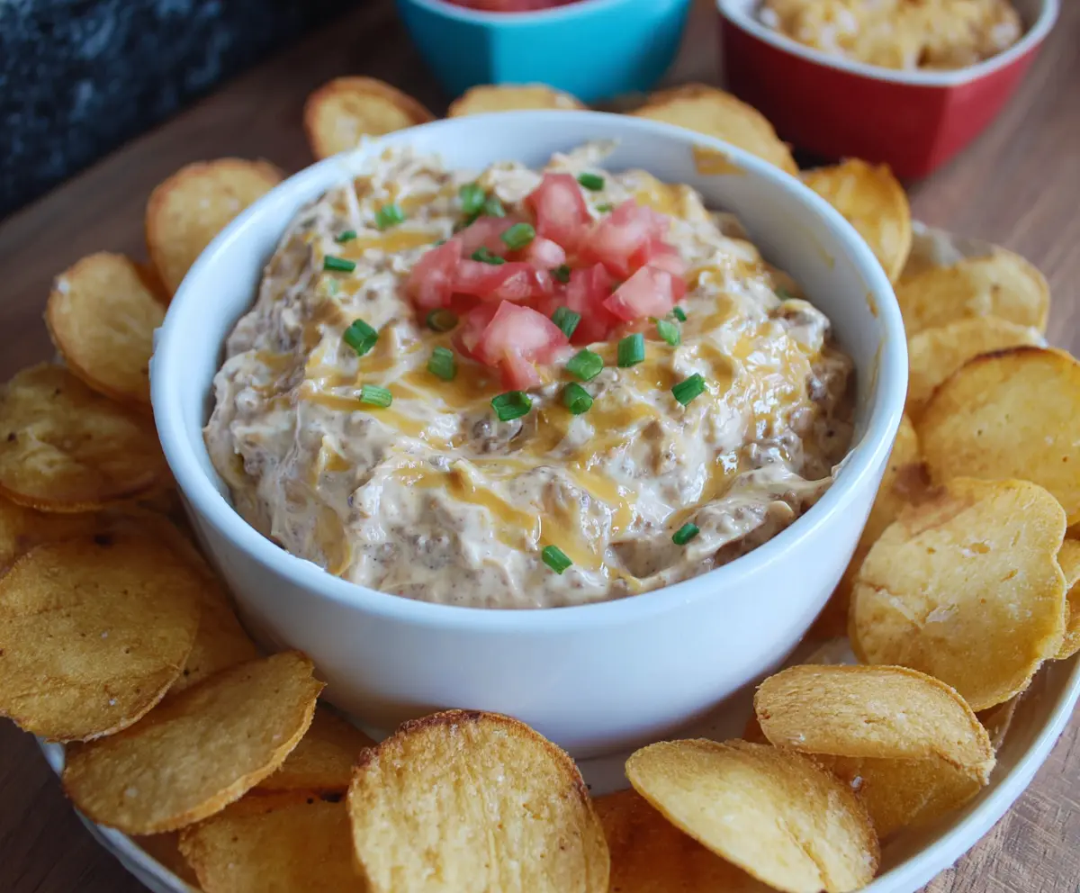 Delicious Slow Cooker Big Mac Dip with layers of seasoned ground beef, cheese, and special sauce in a creamy appetizer.